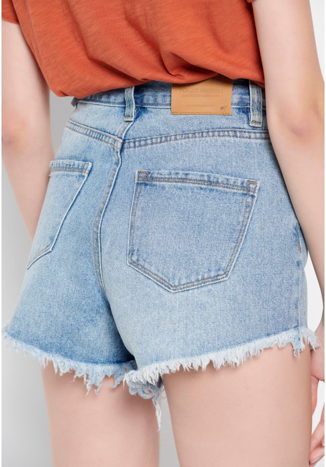 High-rise denim shorts with destroyed effects